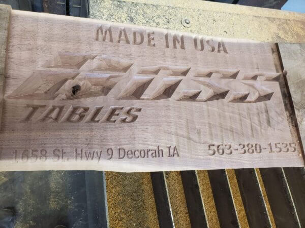 Router cutting a sign with Boss Tables