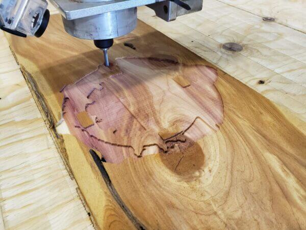 router cutting a design on wood