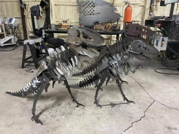art metal made in shape of dinosaurs