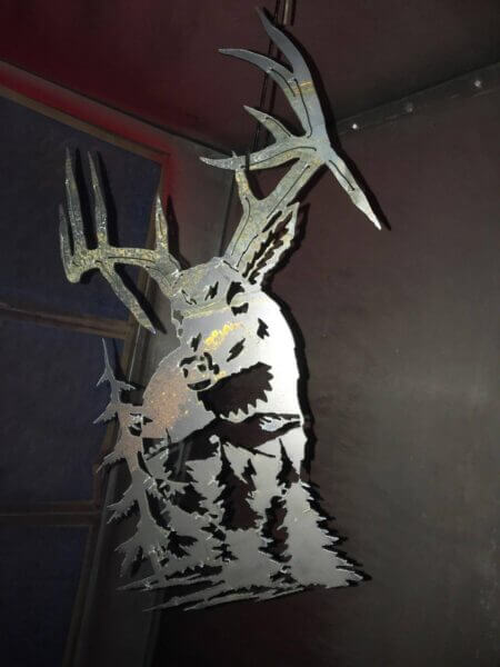 Custom metal sign with deer and trees